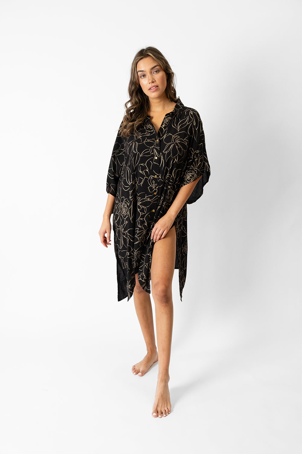 koy resort miami shine big shirt dress in midnight black featuring an abstract gold flower print for spring 2024 women's resort wear collection