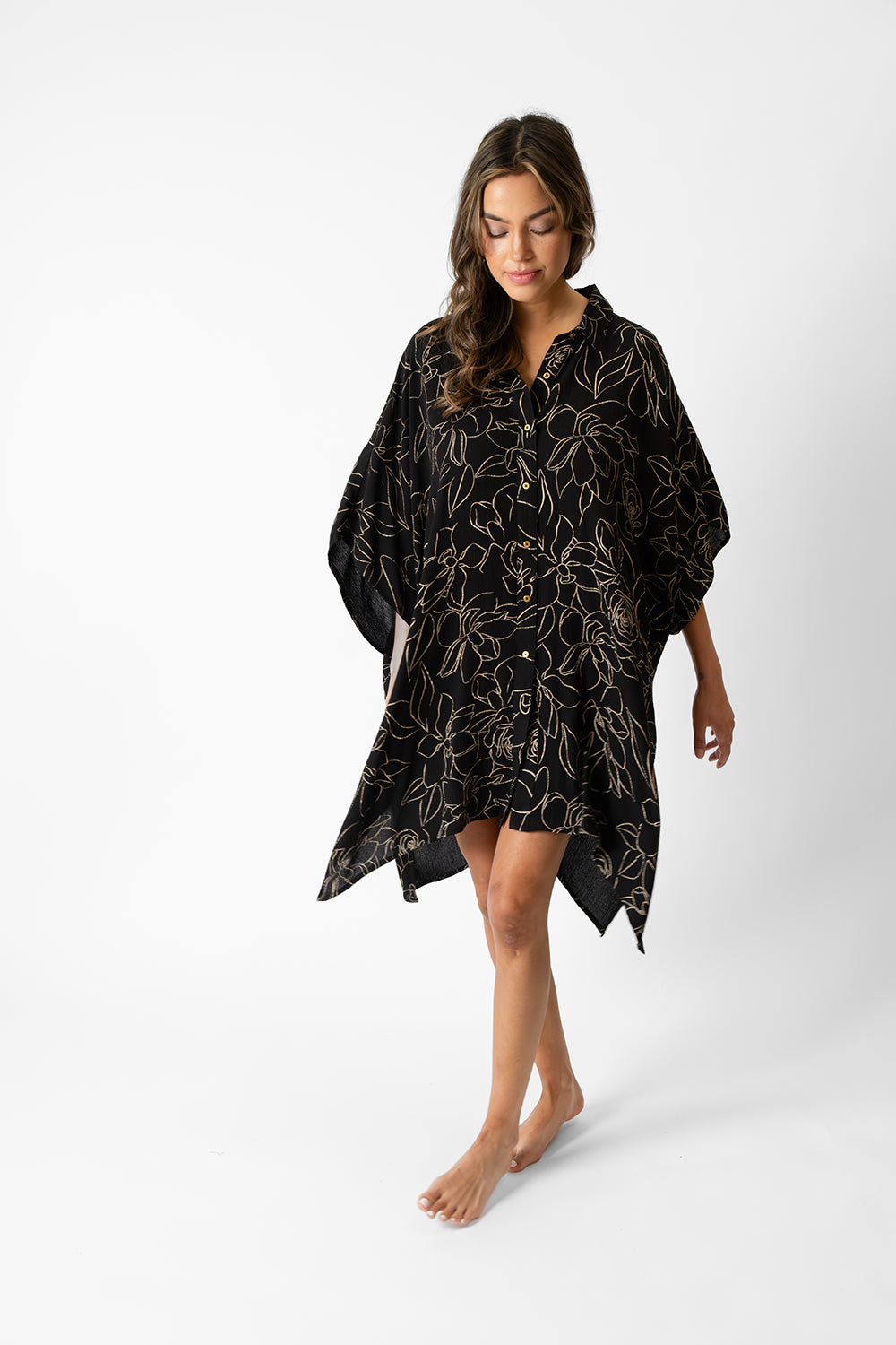 koy resort miami shine big shirt dress in midnight black featuring an abstract gold flower print for spring  2024 women's resort wear collection