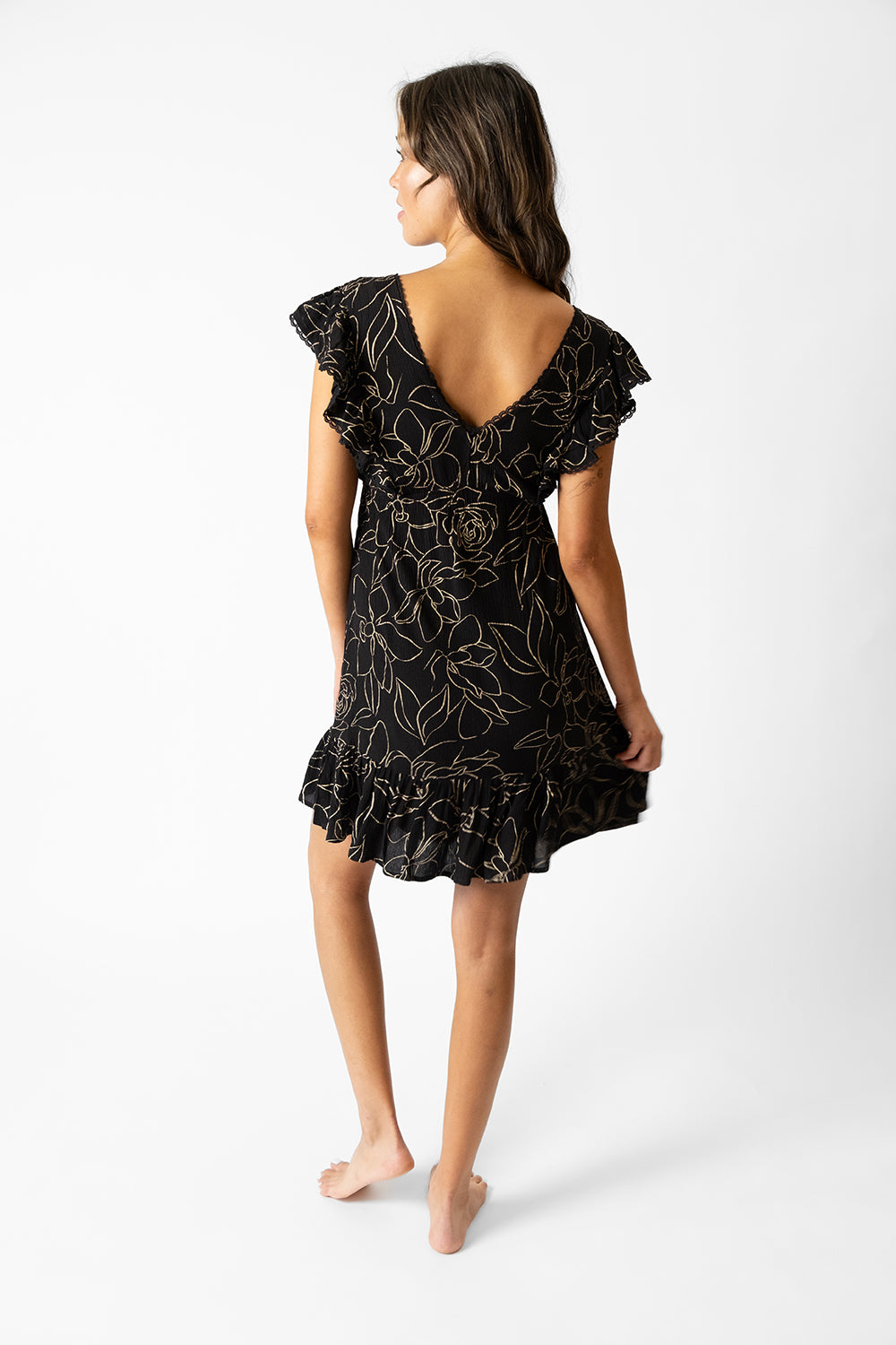 koy resort miami shine ruffle short sleeve v-neck dress with gold tone abstract floral print on black crinkle rayon for spring 2024 women's resort wear collection