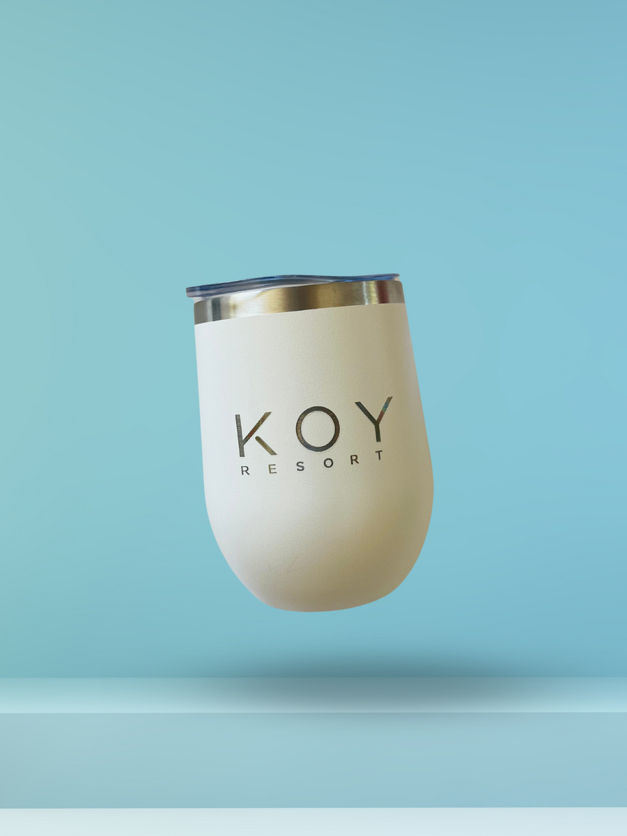 Koy Resort Travel Drink Tumbler, a Summer Pop Up Exclusive. Stainless steel tumbler featuring double-wall insulation, keeping drinks cold for up to 9 hours or hot for 3+. Comes with a metal reusable straw and is sweat-proof. Perfect for hydrating or relaxing on the go, this 12oz tumbler is both dishwasher safe and stylish. Koy Resort affordable vacation, cruise, and resort-wear.