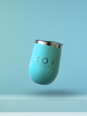 Koy Resort Travel Drink Tumbler, a Summer Pop Up Exclusive. Stainless steel tumbler featuring double-wall insulation, keeping drinks cold for up to 9 hours or hot for 3+. Comes with a metal reusable straw and is sweat-proof. Perfect for hydrating or relaxing on the go, this 12oz tumbler is both dishwasher safe and stylish. Koy Resort affordable vacation, cruise, and resort-wear.