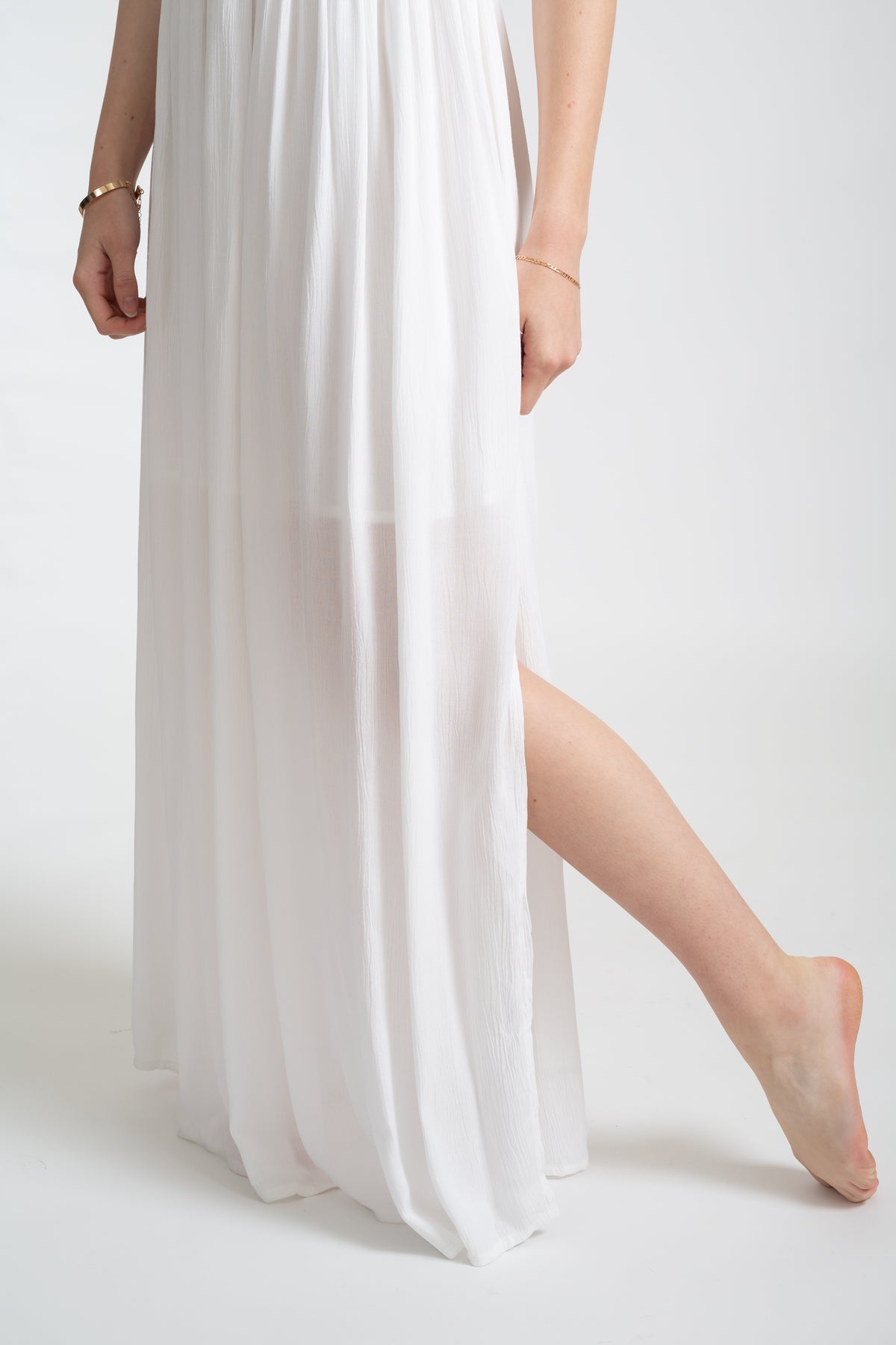 The white Miami maxi bandeau dress with the slit detail by Koy Resort Summer collection facing front close up.